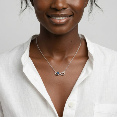 blue topaz birthstone necklace in white gold finish — model view