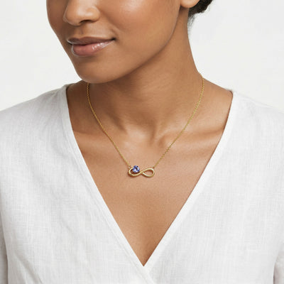 blue topaz birthstone necklace in yellow gold finish — model view