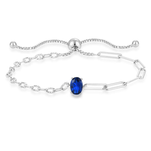 blue sapphire chain bracelet in yellow gold finish — front view