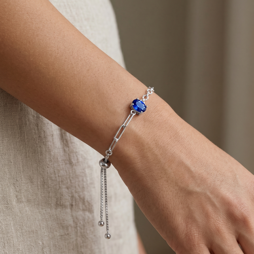 blue sapphire chain bracelet in yellow gold finish — model view