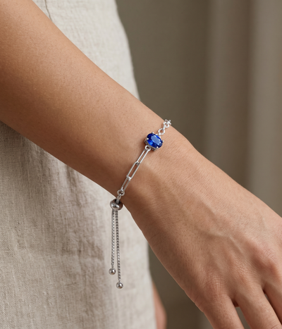 blue sapphire chain bracelet in yellow gold finish — model view