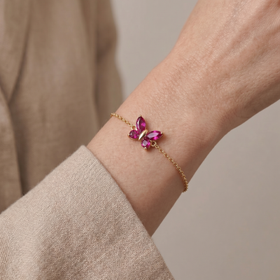 red ruby butterfly bracelet in yellow gold finish — model view